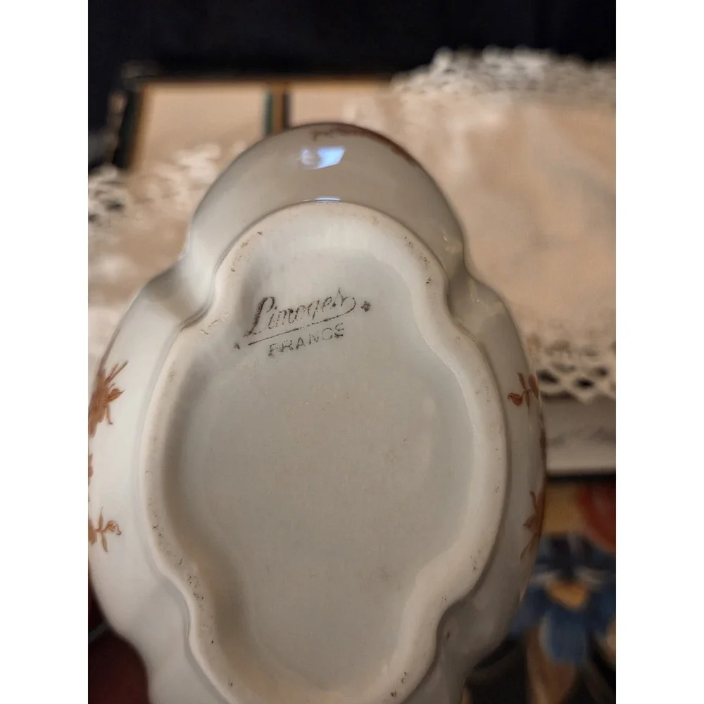 vintage Limoges, France, porcelain compote basket featuring a tall arched...